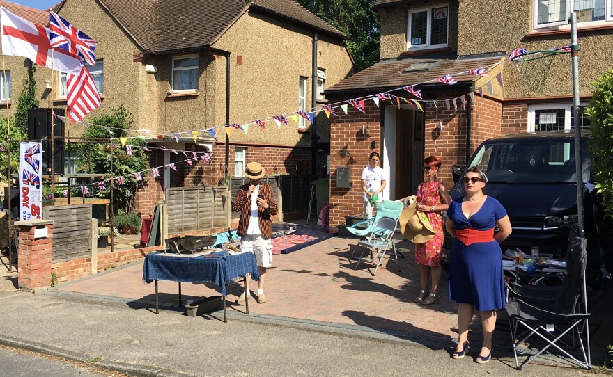 Neighbors in the town of Weybridge outside of London blasted World War II-era tunes and some dressed in 1940s clothing as they held a socially distanced block party to celebrate V-E Day.