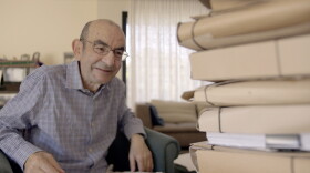 Raja Shehadeh looks at folders from his archive in 2026.