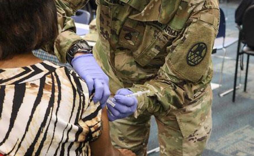 In this undated photo, soldiers with the North Carolina National Guard assist the local health department at a COVID-19 vaccination center in Forsyth County, N.C.