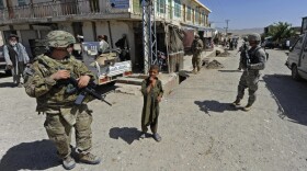 Members of Provincial Reconstruction Team Zabul and 1st Stryker Brigade Combat Team, 25th Infantry Division, make their way to the Zabul Juvenile Detention Facility on Wednesday in Qalat, Afghanistan. 