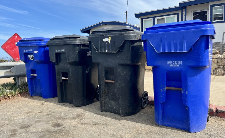 Trash and recycling bins sit curbside in Ocean Beach, Sept. 17, 2025.