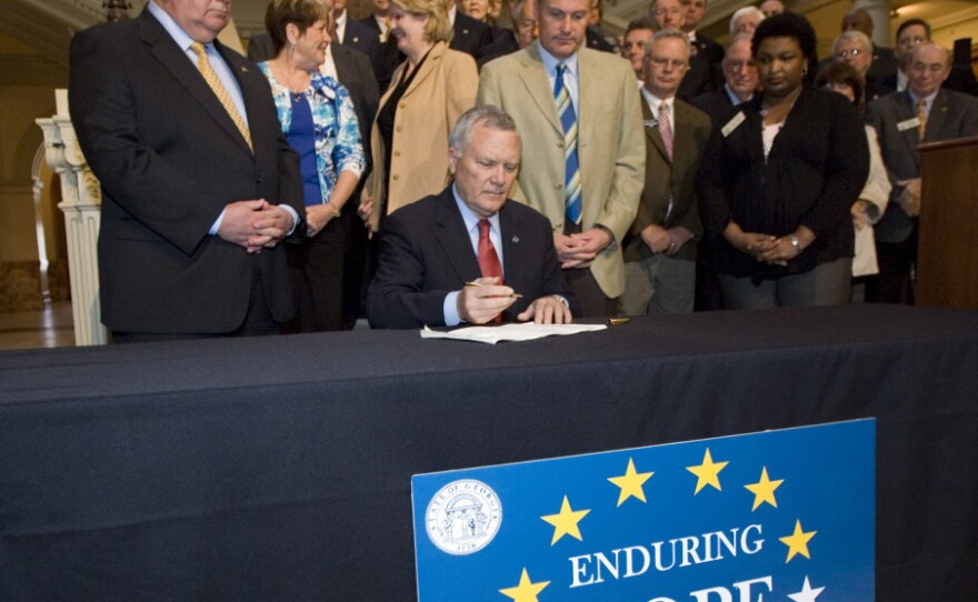 Georgia Gov. Nathan Deal signed the HOPE scholarship funding cuts into law on March 15.