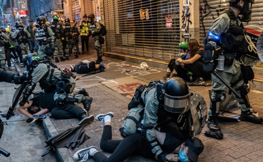 Pro-democracy protesters are arrested by police during a clash at a demonstration in Wan Chai district on October 6, 2019 in Hong Kong.