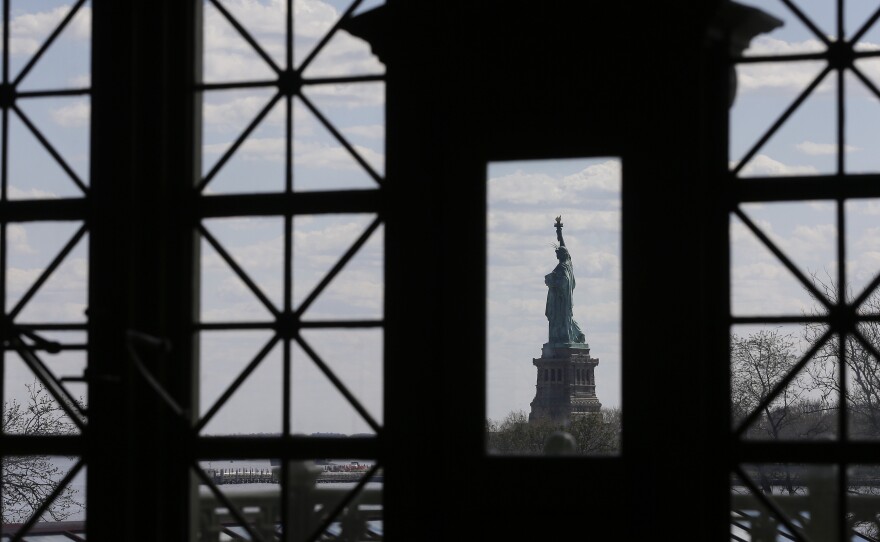The Statue of Liberty, as seen through windows on the south side of the Great Hall at Ellis Island.