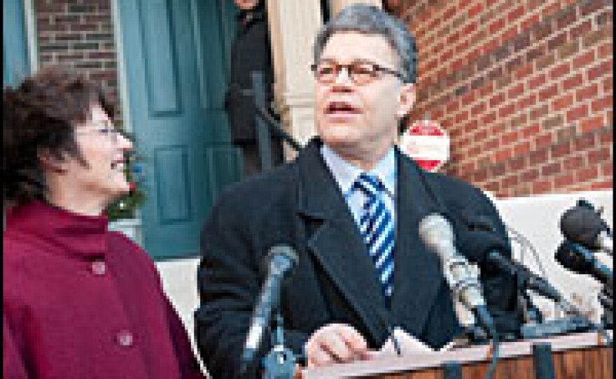 Joined by his wife, Franni, Al Franken speaks Monday in front of his home in Minneapolis after the recount in his bid for the U.S. Senate was certified. Republican incumbent Sen. Norm Coleman has challenged the recount in court.
