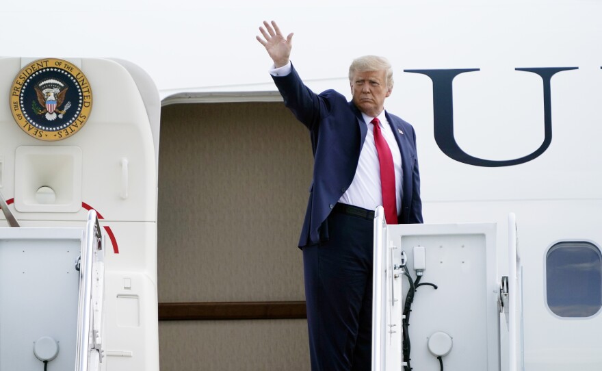 President Trump boards Air Force One at Andrews Air Force Base on Tuesday.