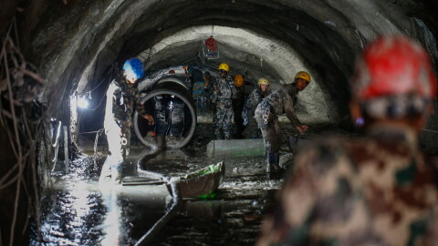 The Nepali Army conducts a search-and-rescue operation on Sept. 10 inside the Chilime Hydropower Station tunnel days after the deadly flash floods and mudslides in Nepal's Rasuwa district in August. In the wake of the disaster, concerns are being raised about the impact of the construction of hydropower plants and dams in the Himalayas.