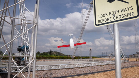 A drone, just returned from a delivery, swings into the landing mechanism in Muhanga, Rwanda. The country's government has contracted with American robotics company Zipline to deliver emergency blood through drones since 2016.