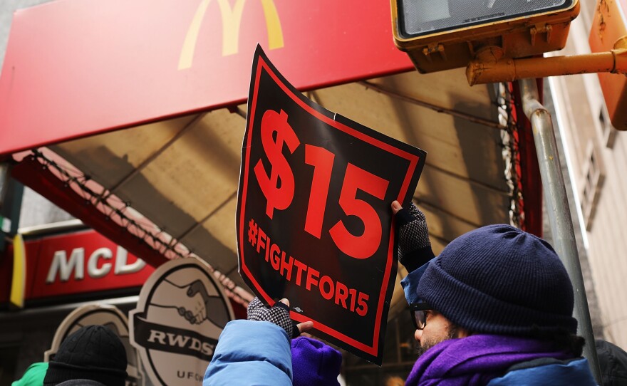 Protesters with NYC Fight for $15 gather in front of a McDonalds to rally against fast food executive Andrew Puzder, who was President Trump's nominee to lead the Labor Department on February 13, 2017 in New York City.