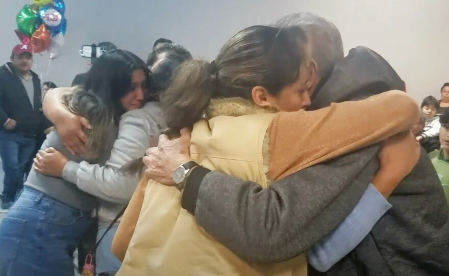 The Rodriguez Tellez family embraces as they are reunited.