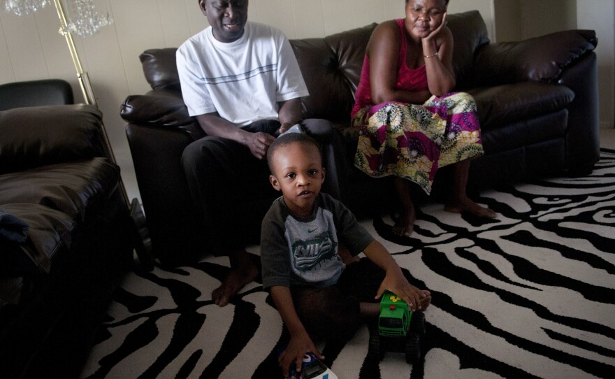 Fafaneva Phillip Avudufu, left and his wife Akouavi Davi with their grandson Joshua, 4, in their apartment in Gaithersburg, Md.