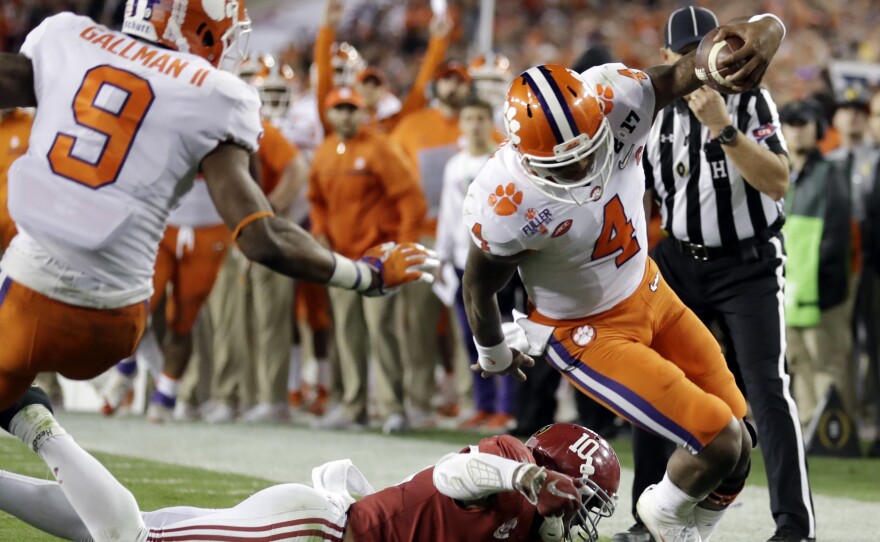 Clemson quarterback Deshaun Watson runs along the sideline for a touchdown Monday against Alabama during the first half of the NCAA college football playoff championship game in Tampa, Fla.