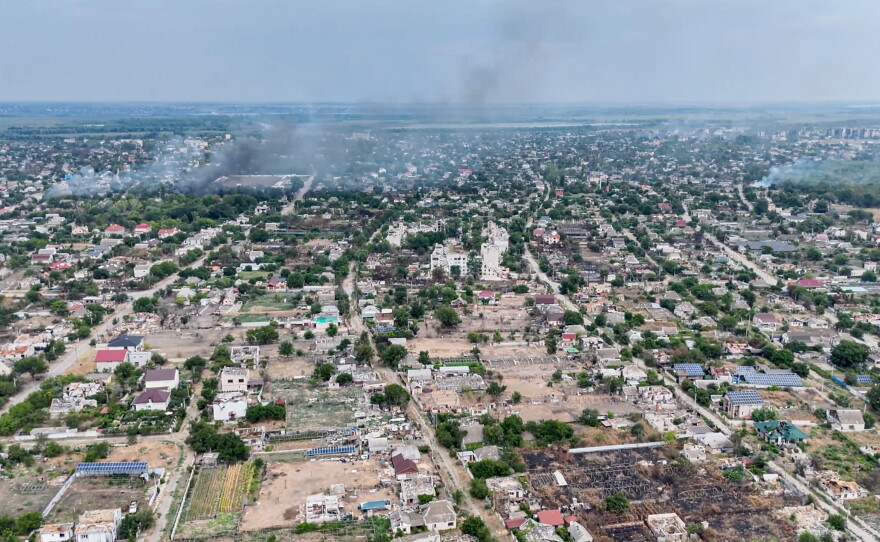 In this undated image from video provided by the Ukrainian 34th Separate Marine Brigade "Borysfen" on Sept. 22, 2026, smoke rises from a residential neighborhood in the Russian-occupied city of Oleshky in the Kherson region of Ukraine.