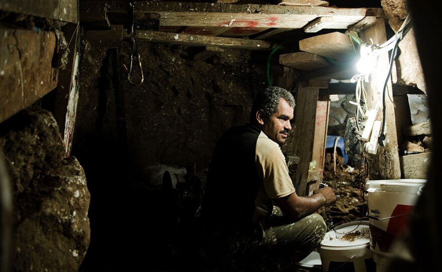 Palestinians living in Gaza work in an underground tunnel that connects Egypt and Gaza for smuggling, July 26. Since Israel eased the blockage of Gaza, the tunnels are now transporting more much needed building supplies: cement, flooring, paint.