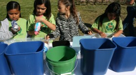 Palmquist Elementary green team members Natally Ramirez, Delia Alcaraz, Mariana Lazaro, and Jasmine Quinones practice sorting trash into bins for CRV, co-mingle recycle, liquid, and trash items. School green teams monitor fellow students’ trash disposal at lunchtime.