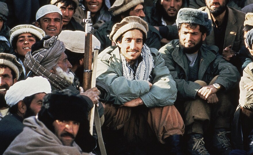 Afghan guerrilla leader, Ahmad Shah Massoud (center) is surrounded by rebel commanders at a meeting in the Panjshir Valley in northeast Afghanistan, in 1984.