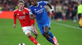 Benfica's Gianluca Prestianni fights for the ball against Real Madrid's Vinicius Junior during a Champions League playoff soccer match between SL Benfica and Real Madrid in Lisbon, Portugal, Tuesday, Feb. 17, 2026.