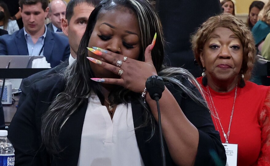 Wandrea "Shaye" Moss, a former Georgia election worker, becomes emotional while testifying about how being singled out in false claims that the 2020 election was stolen from Donald Trump has ruined her life.