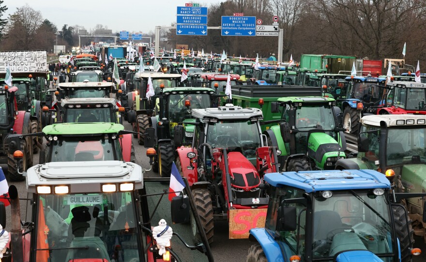 Farmers take part in a protest called by local branches of major farm unions, blocking the A35 highway with tractors near Strasbourg, eastern France, Jan. 30, amid nationwide protests called by farmers' unions.