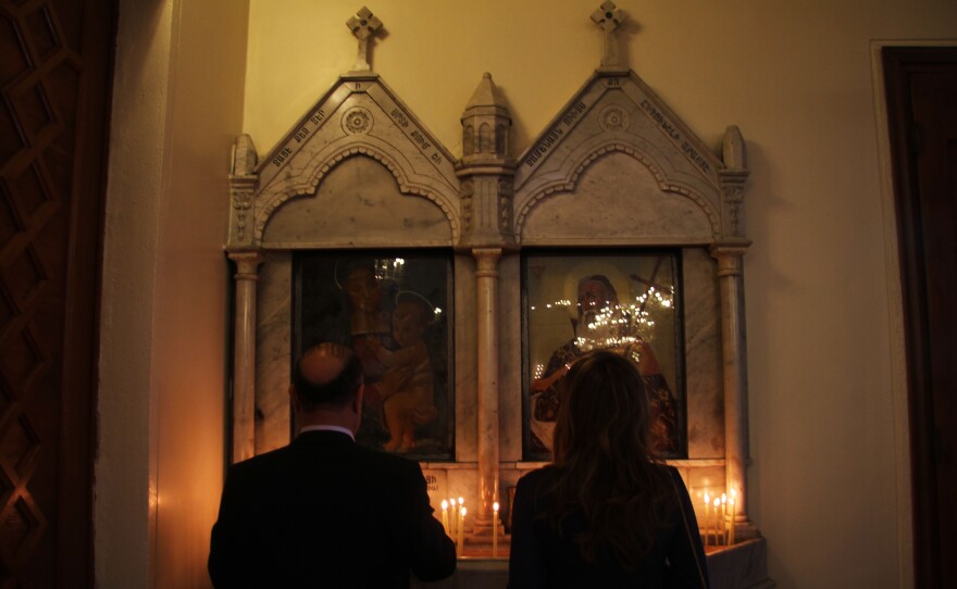 Two worshipers say prayers. Even amid Easter celebrations, Armenians in the Middle East remain apprehensive about the future.