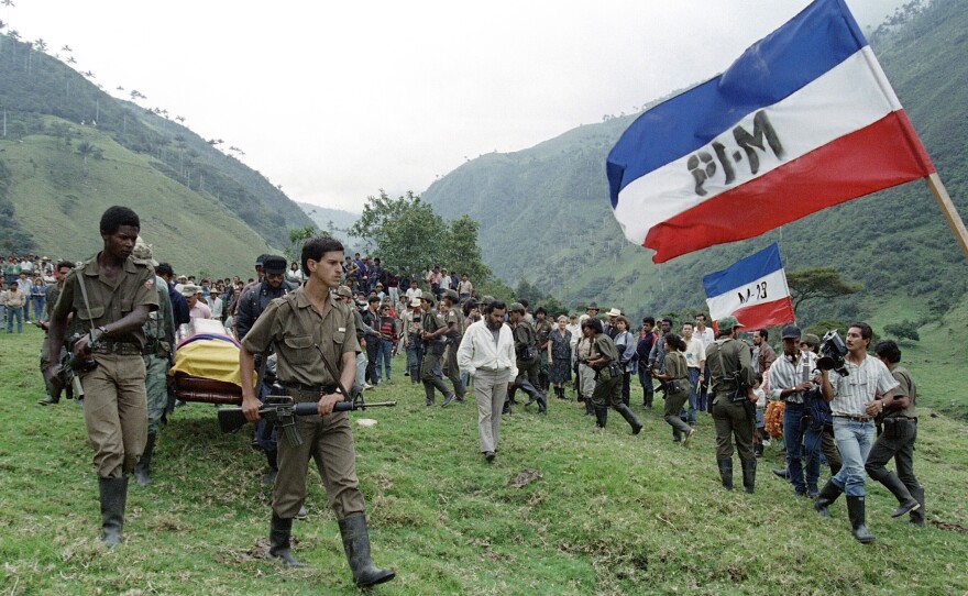 M-19 rebels carry the coffin of Mayor Afranio Parra, days after he was killed by police on April 7, 1989, in Colombia's Santo Domingo mountains before a burial ceremony. M-19 was one of several Colombian leftist guerrilla groups.