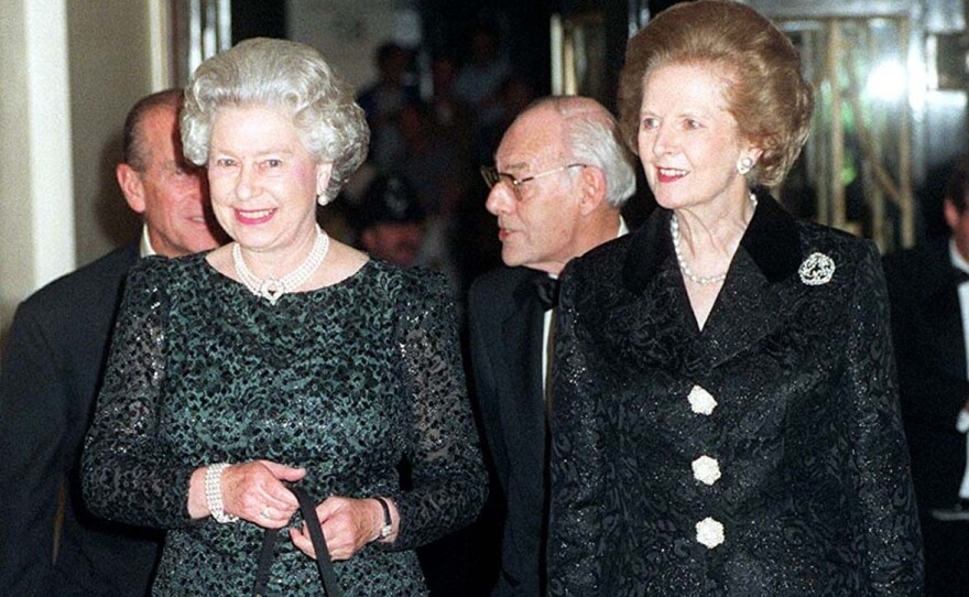 Britain's Queen Elizabeth II, left, and former British Prime Minister Thatcher arrive at Claridge's in London for a dinner to celebrate the former Prime Minister's 70th birthday on October 16, 1995.