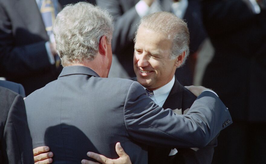 President Bill Clinton (left) hugs then-Sen. Joe Biden during a 1994 signing ceremony for the crime bill at the White House.