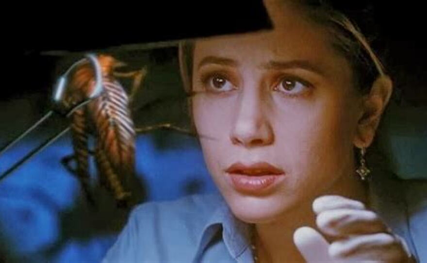 Mira Sorvino and one of the insects in "Mimic." (1997)