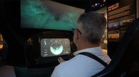 An individual interacts with part of an exhibit at the Navy SEAL Museum, Sept. 29, 2025.