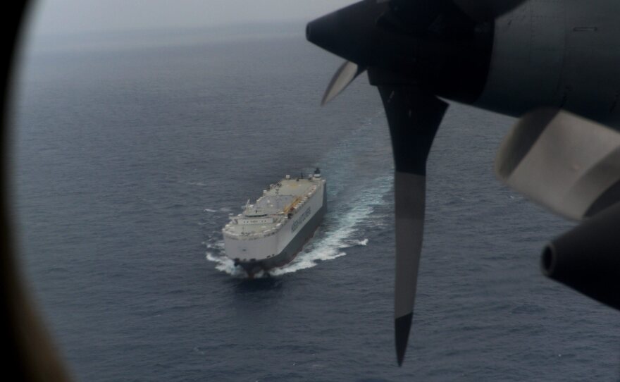 Searching from the air and on the sea: The view Friday from a Royal Australian Air Force P-3 Orion. The Norwegian car transport ship Hoegh St. Petersburg is below. They're part of the search in the southern Indian Ocean for Malaysia Airlines Flight 370.