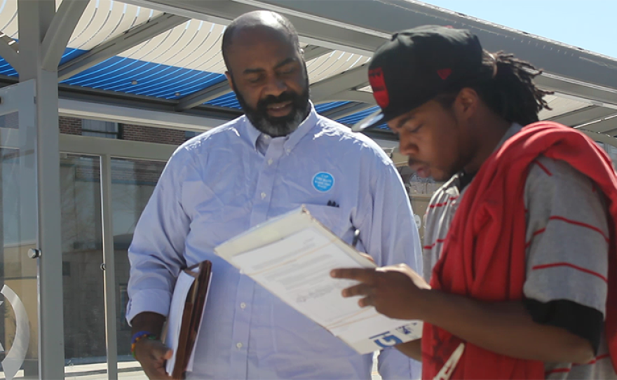 Volunteers gather signatures for the Cap-the-Rate ballot initiative.