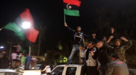 Libyan rebels celebrate in Benghazi on Thursday after the United Nations Security Council's resolution to impose a no-fly zone over Libya.
