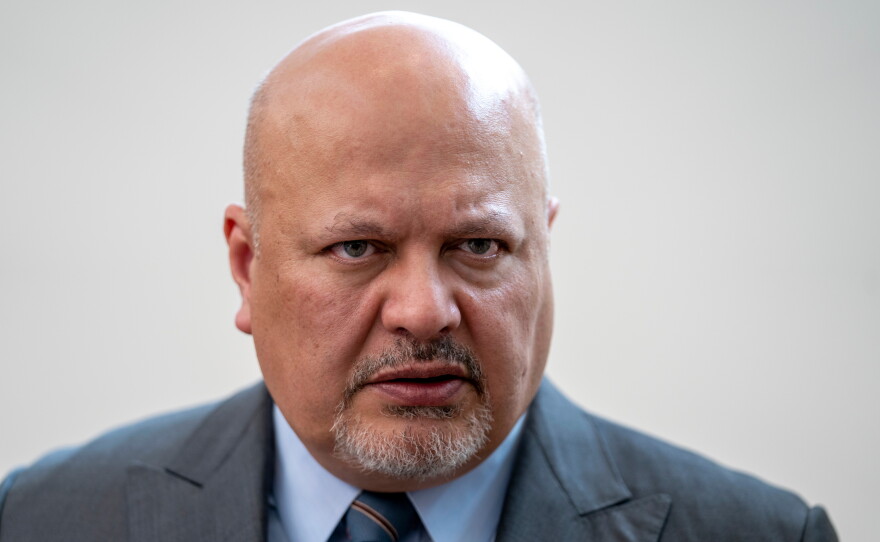 Karim Khan, Prosecutor of the International Criminal Court, looks up prior to a press conference in The Hague, Netherlands, July 3, 2023.
