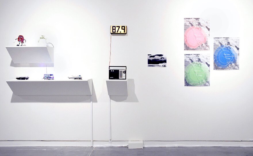 Work by Cog•nate Collective, including portions of their "Border Blasters" project are shown in a previous installation in an undated photo.