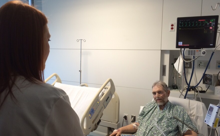 Cleveland Clinic pharmacist Katie Greenlee talks with Morgan Clay about how he should take his prescriptions when he leaves the hospital.