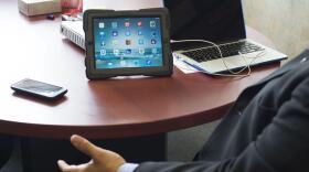 Sweetwater Union High School District spokesman Manuel Rubio shows one of the iPads purchased by the district. In 2012 the district bought almost 8,000 iPads for all seventh graders. May 26, 2017.