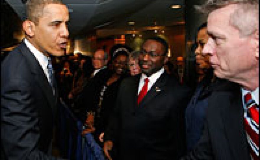 President Obama visits employees at the Department of Veterans Affairs in Washington on Monday. The agency is expected to see increased hiring under Obama's budget proposal.