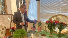Mehdi Moein shows the traditional Newruz table set up at the House of Iran in Balboa Park for the Persian New Year. 