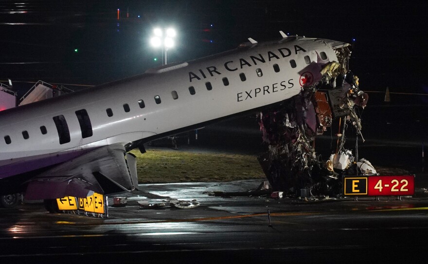 An Air Canada Jet sits on the runway at LaGuardia Airport, Monday, March 23, 2026, after colliding with a Port Authority aircraft rescue and firefighting vehicle after landing in New York.
