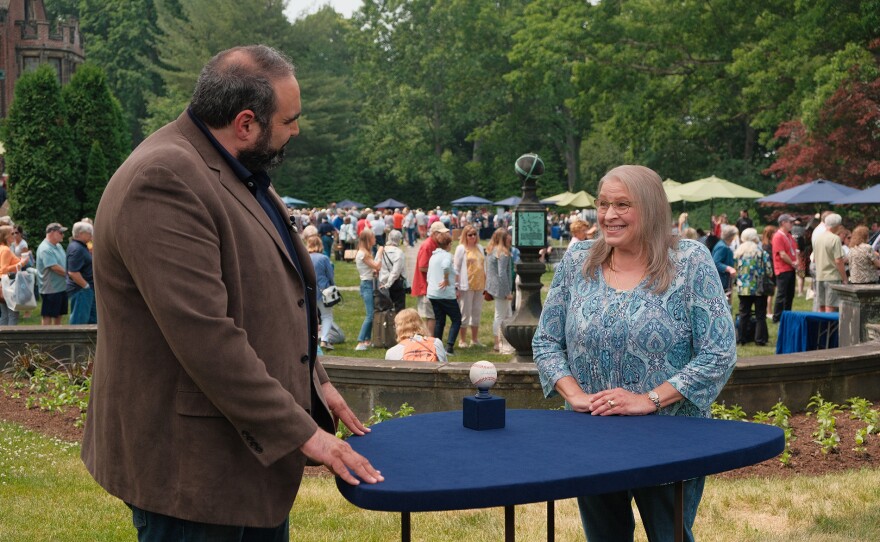 Simeon Lipman (left) appraises a Thurman Munson-signed baseball, ca. 1975, in Akron, Ohio. ANTIQUES ROADSHOW “Stan Hywet Hall &amp; Gardens, Hour 3” premieres Monday, May 13 at 8/7C PM on PBS.