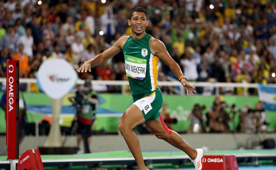 Wayde van Niekerk of South Africa celebrates after winning the 400-meter final and setting a world record of 43.03 on Sunday at the Olympic Stadium in Rio.