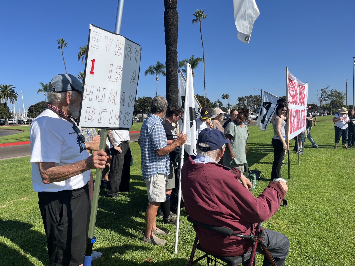 Protestors gather at Shelter Island ahead of USS Lincoln arrival on Oct. 8, 2026.
