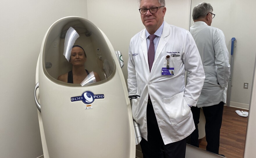 NPR's Allison Aubrey has her body composition measured inside a BodPod. Several other tests performed at the longevity lab — led by Dr. Douglas Vaughan — are used to estimate biological age.