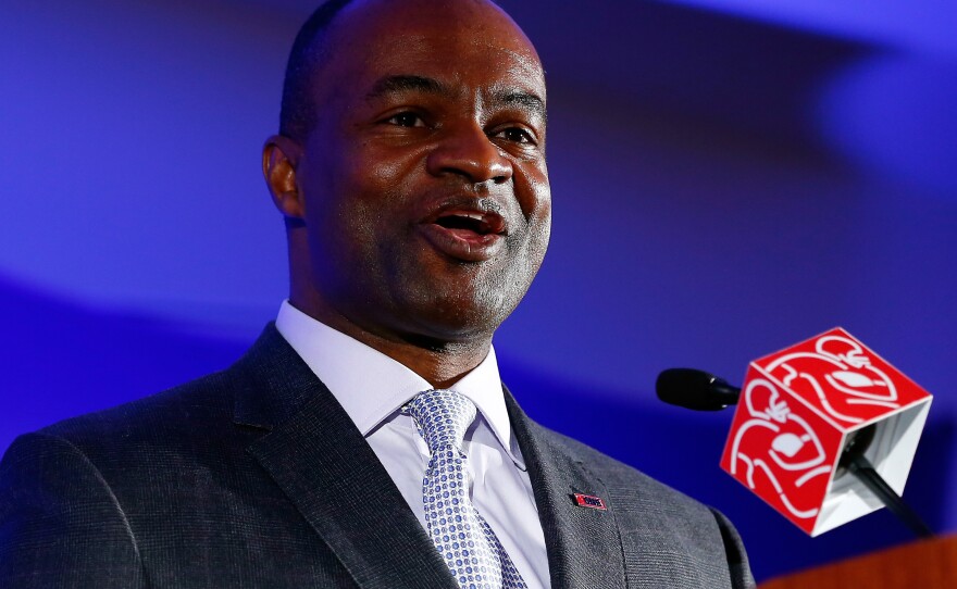 DeMaurice Smith, executive director of the National Football League Players Association, speaks during a news conference in 2014.