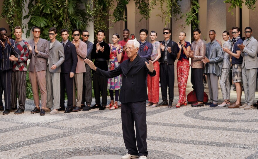 Giorgio Armani acknowledges the audience during the Milan Men's Fashion Week in June 2019.