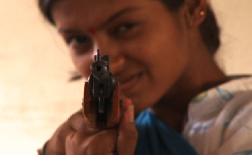 Renuka learns to use a rifle at the Durga Vahini camp.
