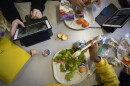 Seventh-graders sit together in the cafeteria during their lunch break at a public school in Brooklyn, N.Y., on Feb. 10, 2023.