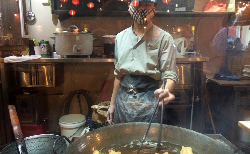 A food vendor at Hawker Center, Airport Road, Singapore