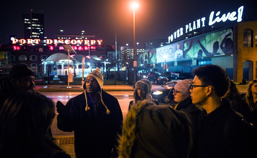 Simmons leads a group of Johns Hopkins students on what he calls a "justice walk" through downtown Baltimore, where they discuss public policy and the connections between economic inequality and health in the city.