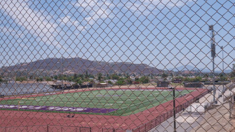 Santana High School's football field, on the east side of campus, is shown through a chain link fence on Aug. 12, 2026.